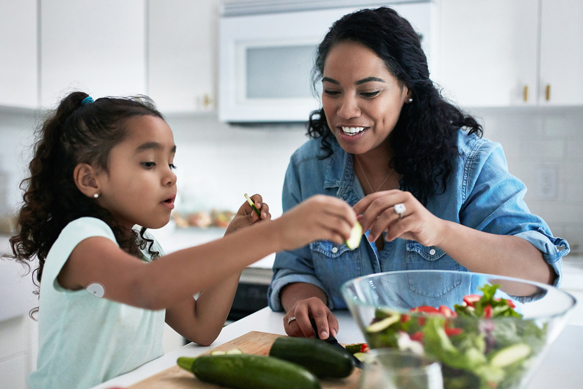 Mother and Daughter Preparing for a Meal