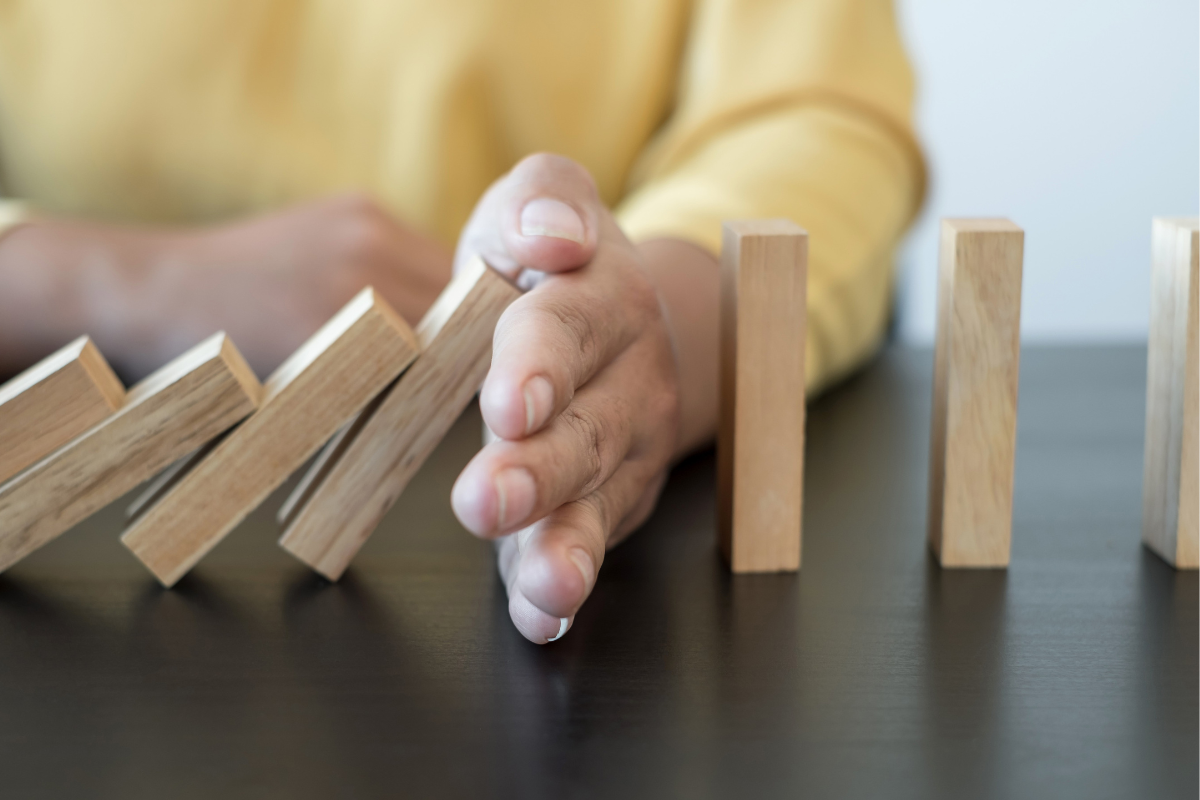 Halting Type 1 Diabetes - Hand is Stopping the Dominos From Falling