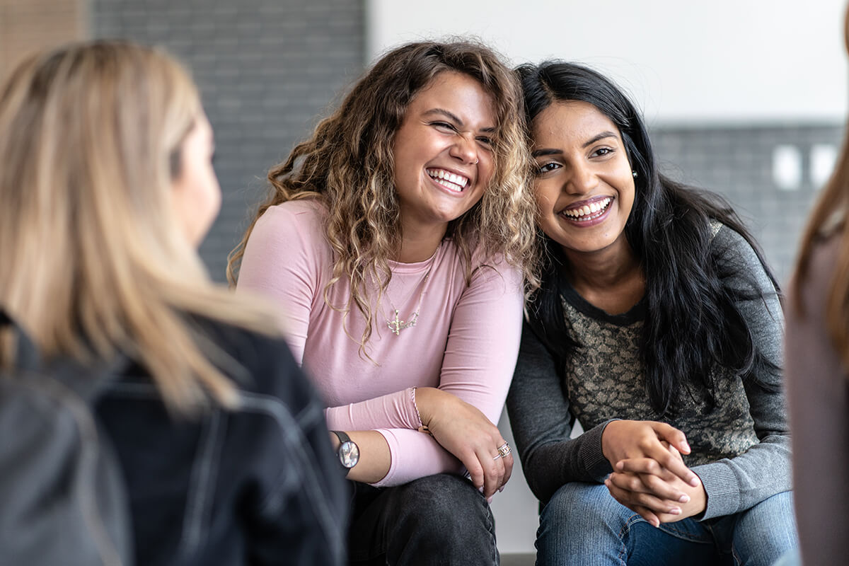 Two teenagers laughing