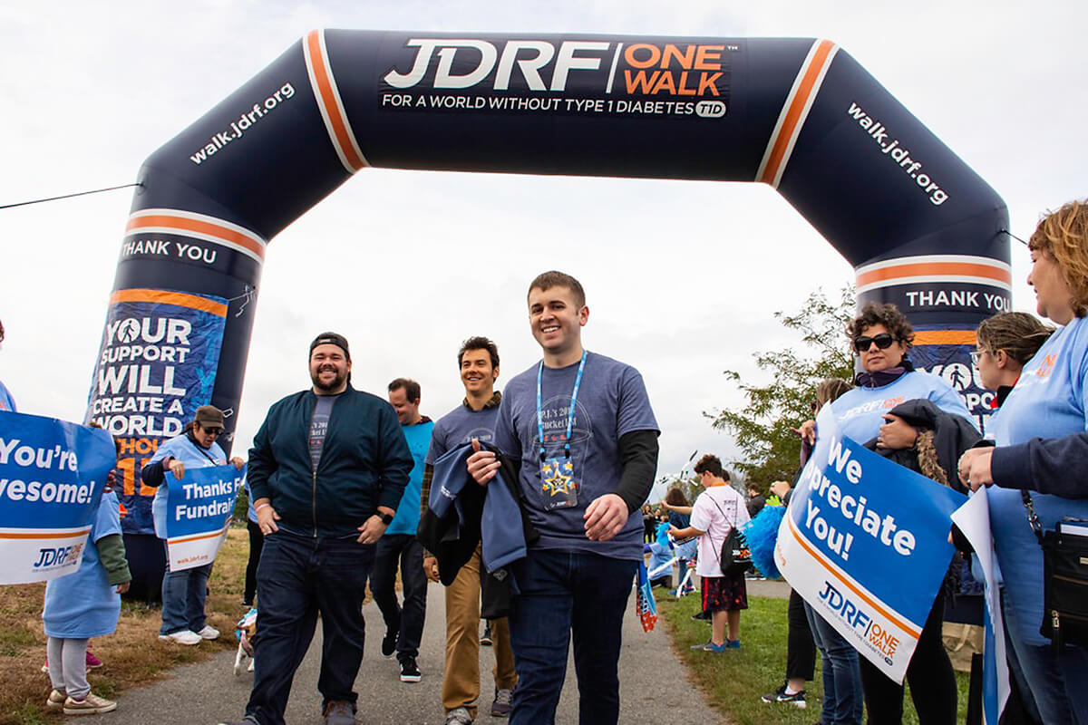 P.J. Pimpinelli crosses the Breakthrough T1D One Walk finish line