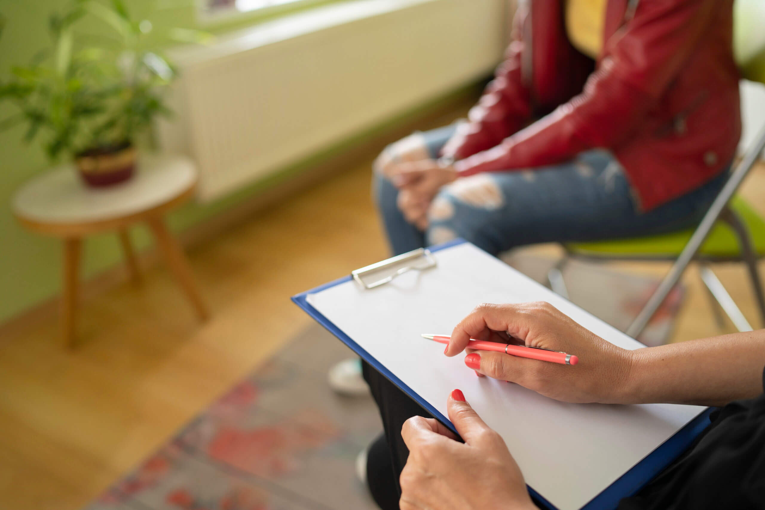 Close up of a psychologist taking notes